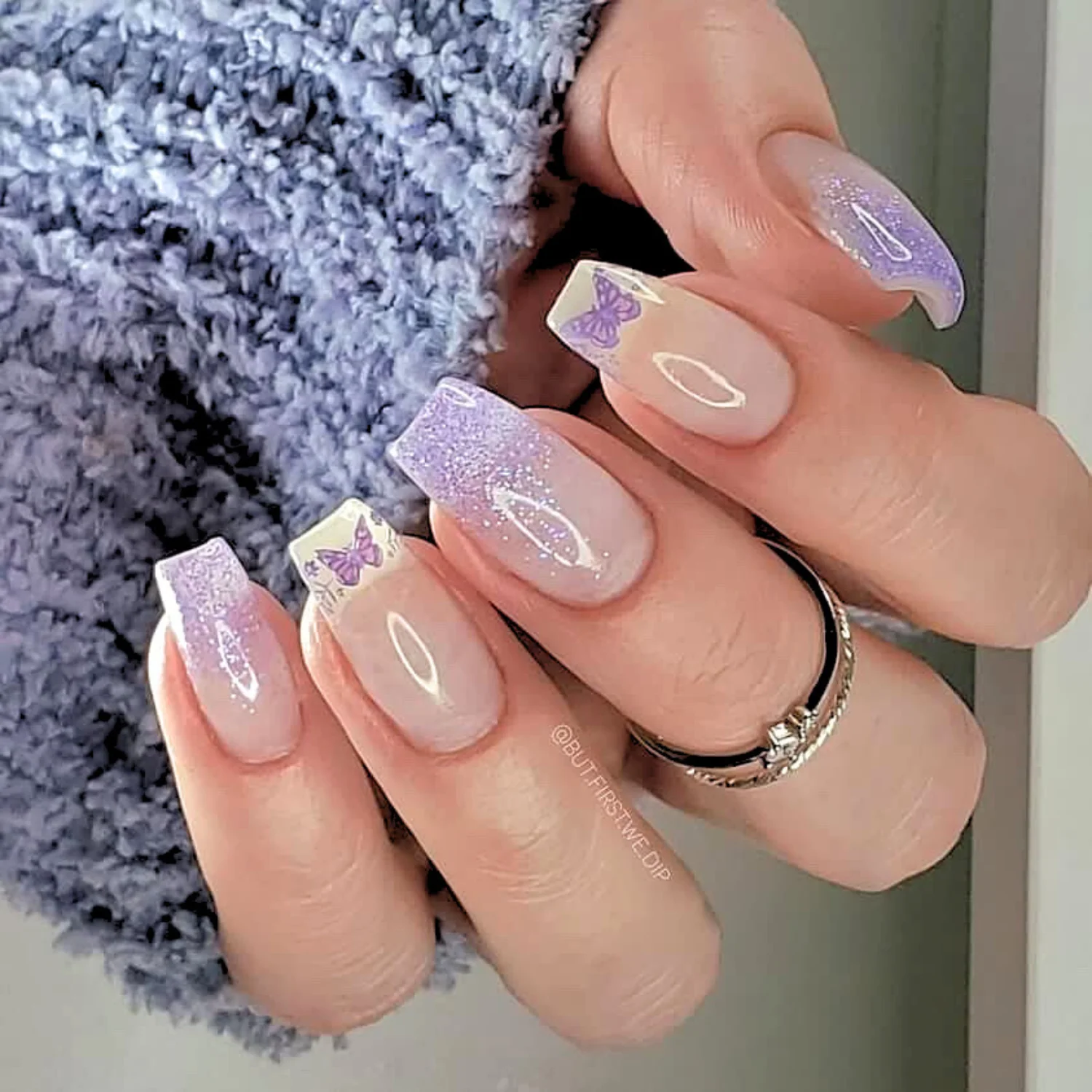 Lavender glitter nails with butterfly accents