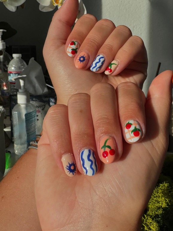 Playful cherry and sun nail art
